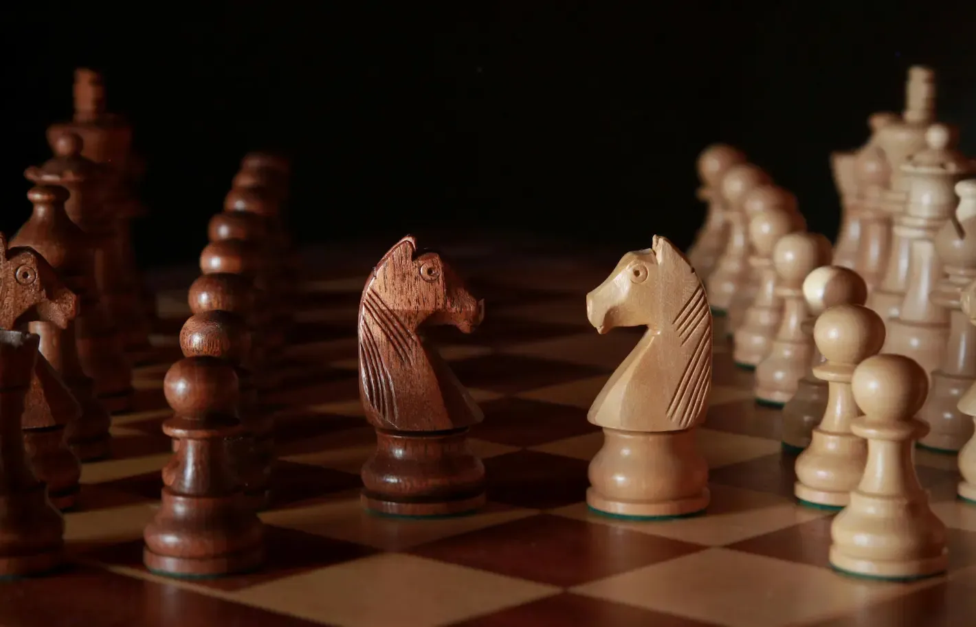 Chess board mid-game — the strategic decision to settle or go to court
