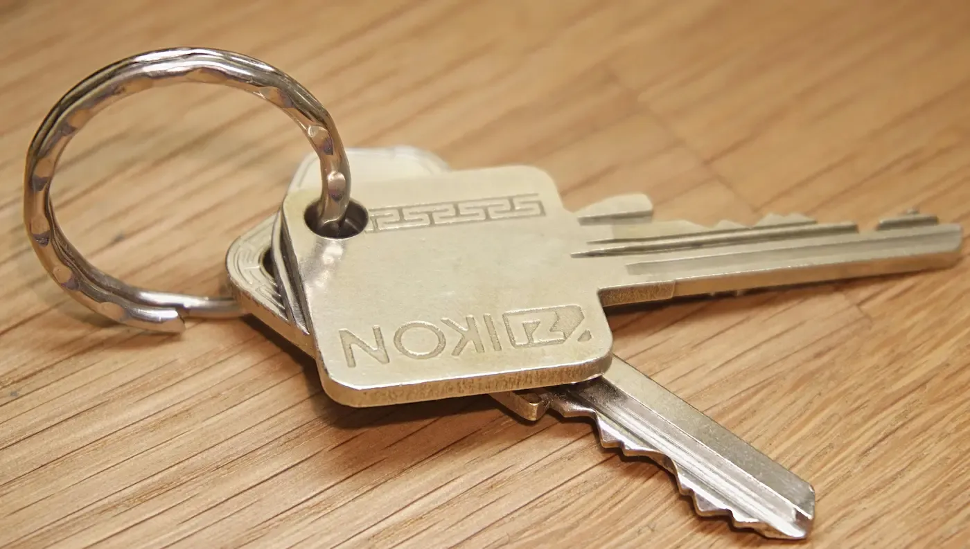 House keys on a wooden table — property division in Alberta divorce