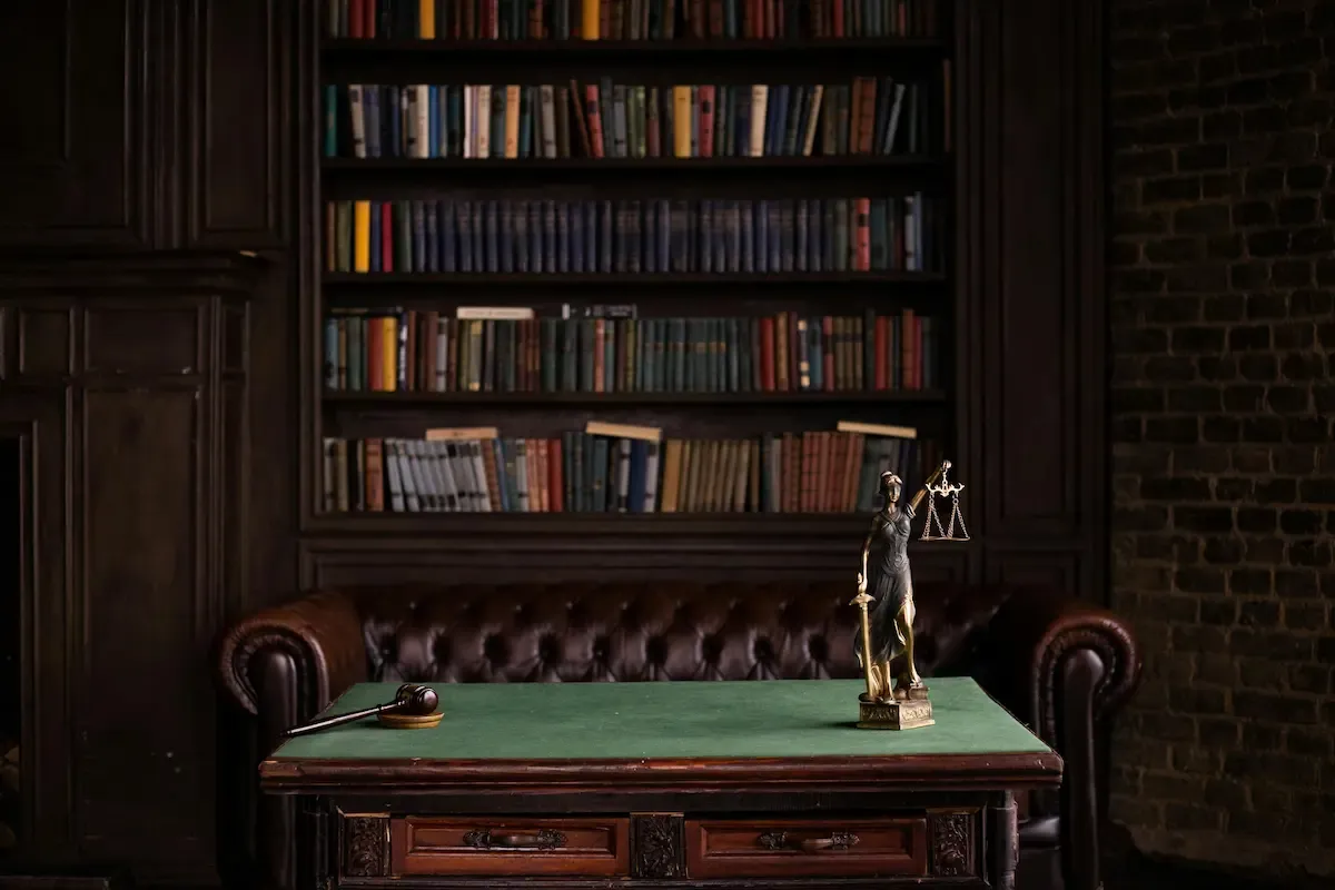 A quiet study with leather chesterfield and law library — Edmonton Top Law